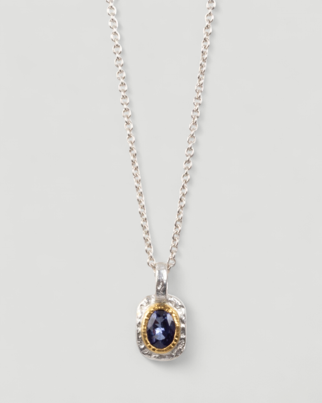 Bicolor Silberanhänger mit Tansanit (0.89 ct) in 999 Goldfassung mit 925 Silberkette - Goldschmiede Krack